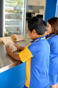 Students ordering tuckshop